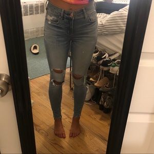 Ripped light wash mid rise jeans